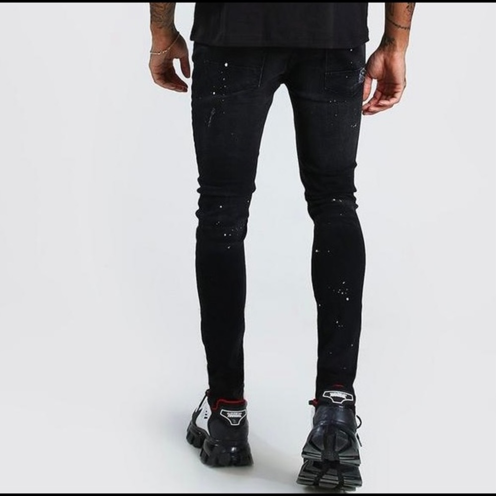 Super skinny distressed paint splat jeans